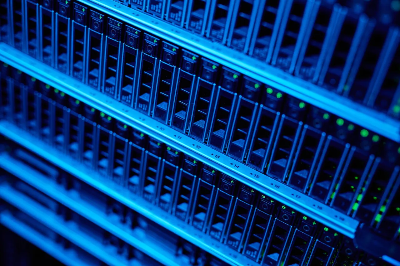 Server racks and a compliance file in a quiet Isle of Man office