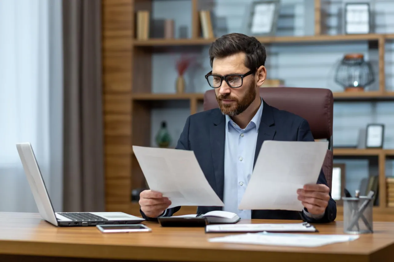 An adviser reviewing identity-verification and redaction decisions against Isle of Man Applied GDPR guidance